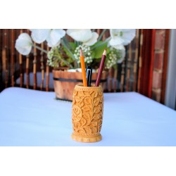 Hand carved wooden pen holder with a floral design