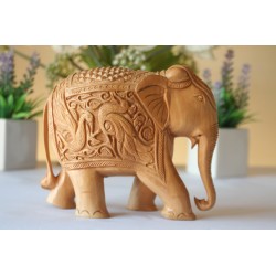 Hand carved Wooden elephant with peacocks carvings on its body.