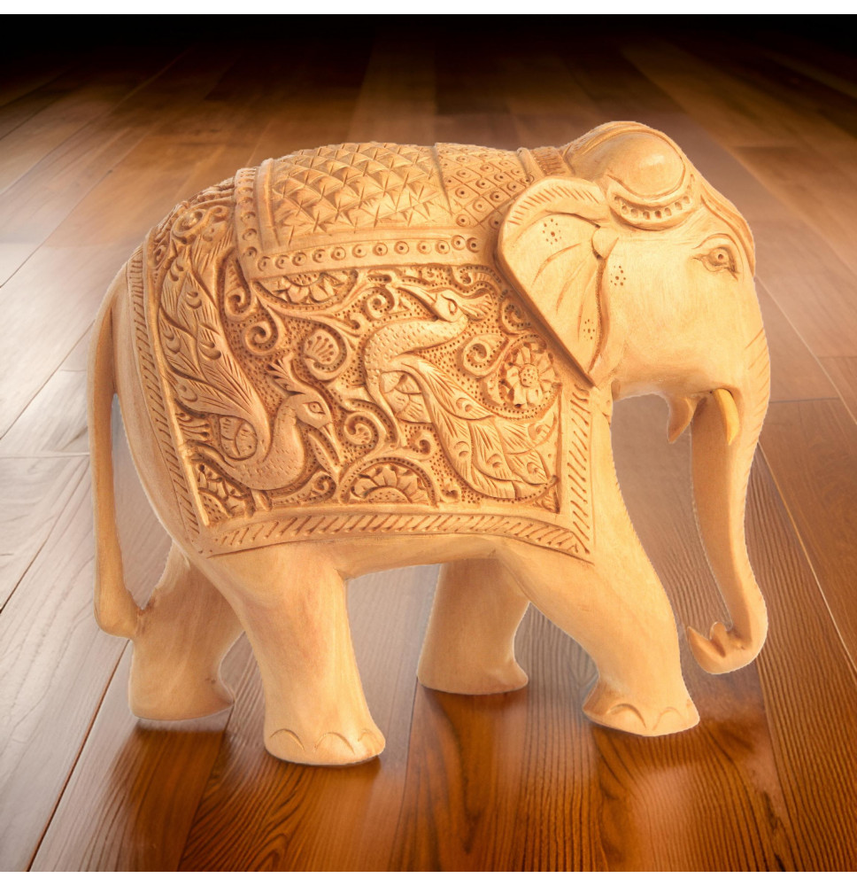 Hand carved Wooden elephant with peacocks carvings on its body.